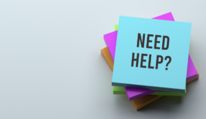 A post-it with "Need Help?" written on top.